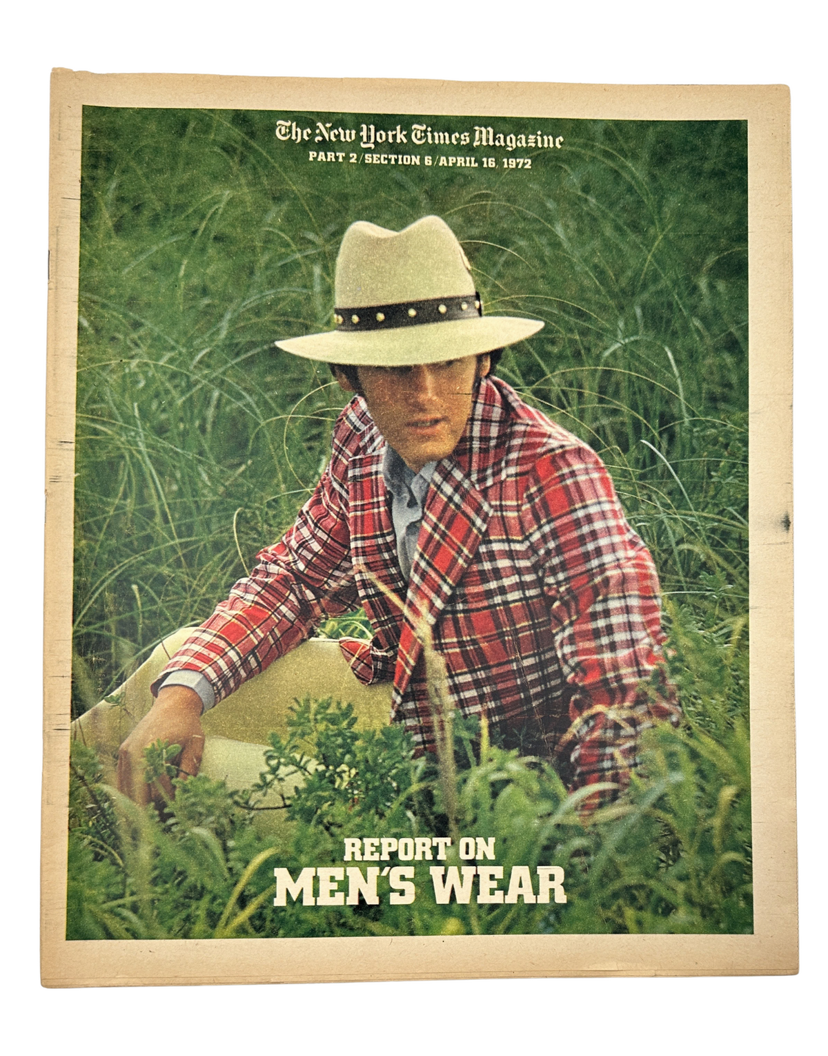 The New York Times Magazine April 16, 1972 Report on Men’s Wear cover featuring a man in a plaid suit and wide-brimmed hat standing in a grassy field.