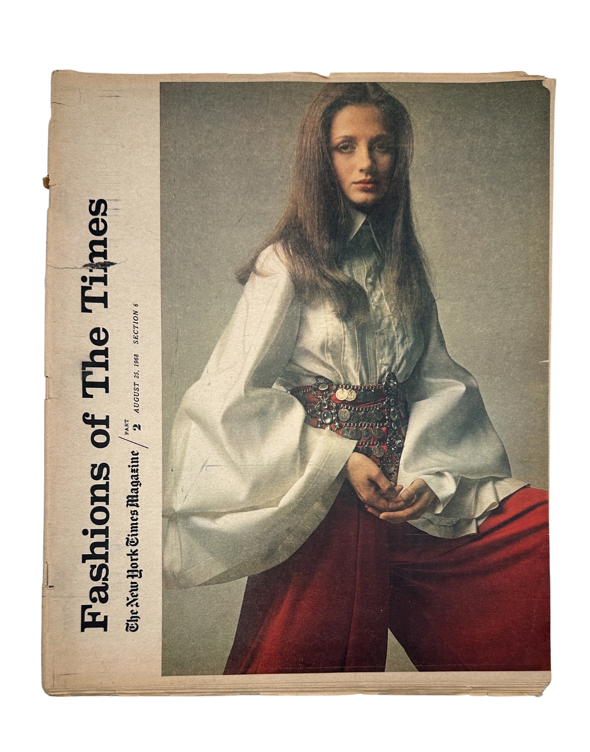 The New York Times Magazine August 25, 1968 Fashions of the Times cover featuring a model in a stylish white blouse and red pants, showcasing late-1960s fashion.