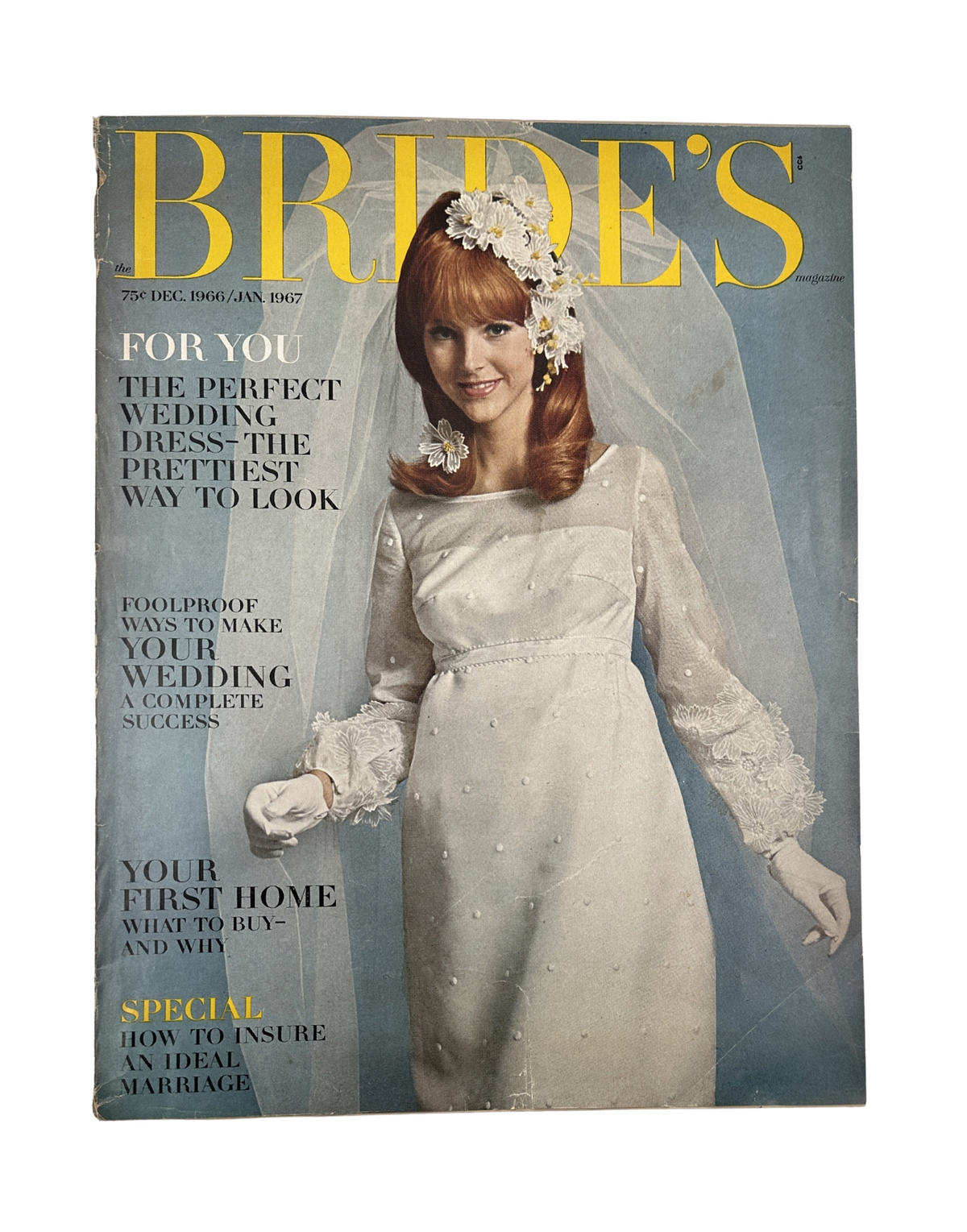 Cover of Bride's Magazine December 1966-January 1967 featuring a bride in a silk organza wedding dress with a floral headpiece, promoting tips for the perfect wedding dress and how to ensure an ideal marriage.