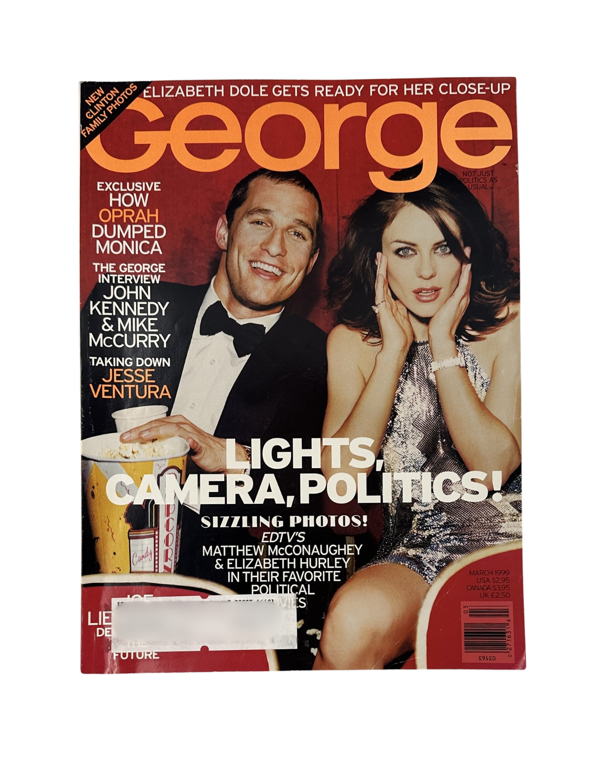 Cover of George Magazine March 1999 featuring Matthew McConaughey and Elizabeth Hurley, highlighting the theme 'Lights, Camera, Politics!' and includes mention of Oprah and Jesse Ventura.