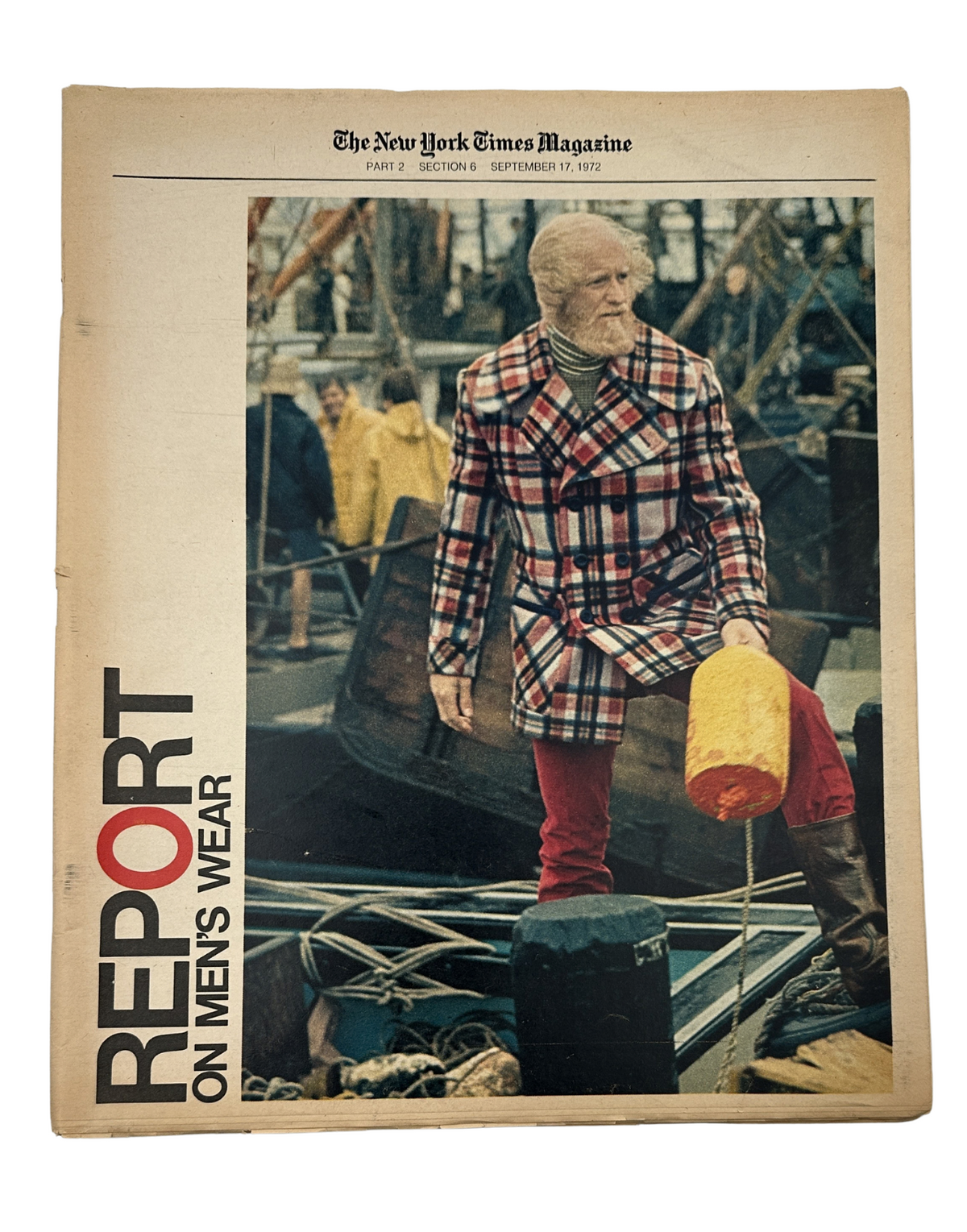 Cover of The New York Times Magazine, September 17, 1972, featuring a man in a stylish plaid coat, representing the Report on Men's Wear, highlighting early-1970s fashion trends.