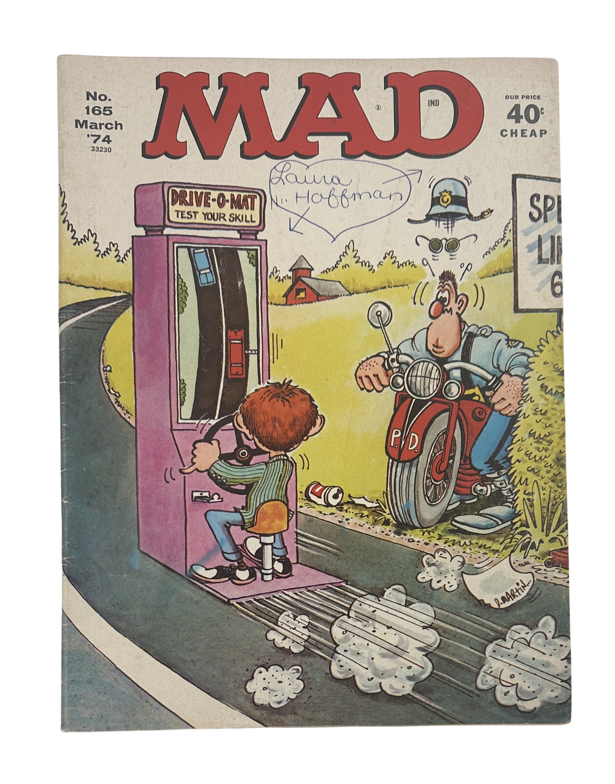 Cover of MAD Magazine No. 165 March 1974, featuring a humorous illustration of a boy playing a game called 'Drive-O-Mat' while a police officer observes on a motorcycle.