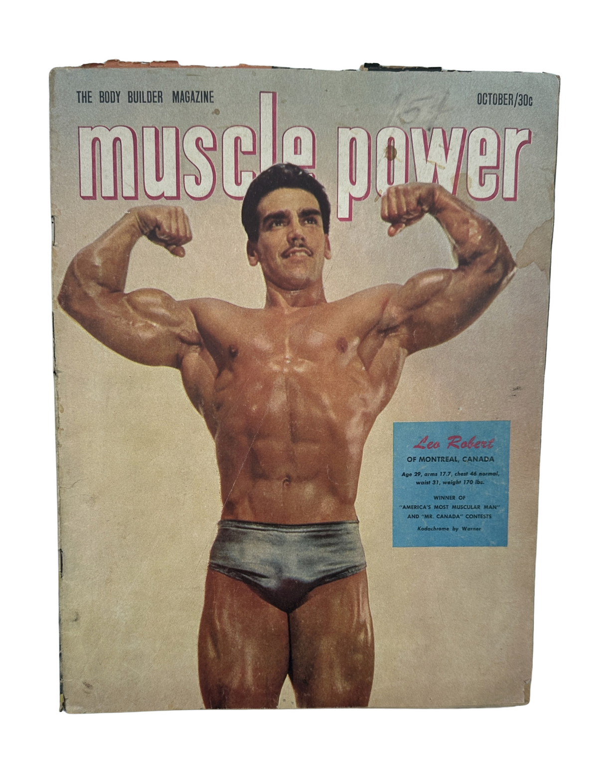 Muscle Power Magazine October 1952 featuring Leo Robert on the cover, showcasing a muscular male bodybuilder posing, representing the bodybuilding culture of the time.