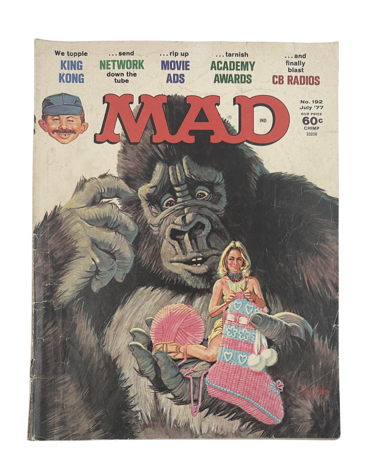 Cover of MAD Magazine No. 192 from July 1977 featuring a King Kong parody, highlighting a giant gorilla holding a woman, capturing the satirical essence of movie ads and awards.