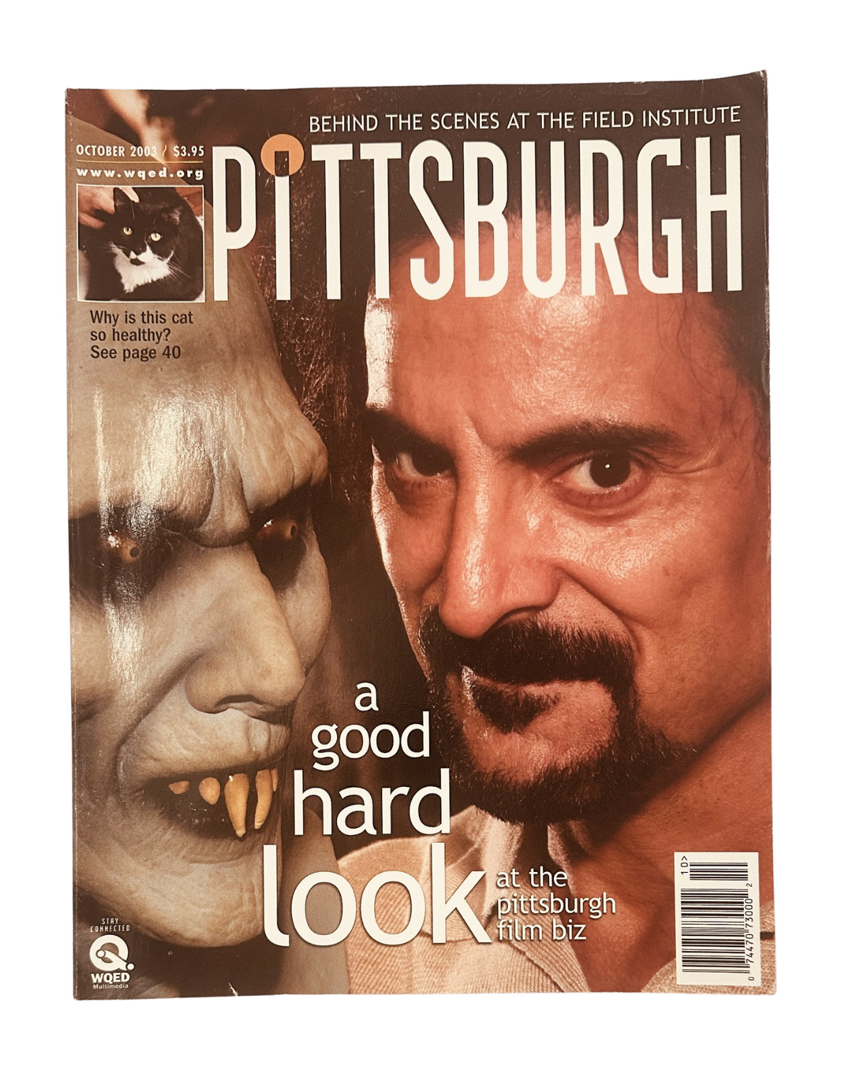 Cover of Pittsburgh Magazine, October 2003, featuring a visually striking image related to the film industry and WQED, titled 'a good hard look at the pittsburgh film biz'.