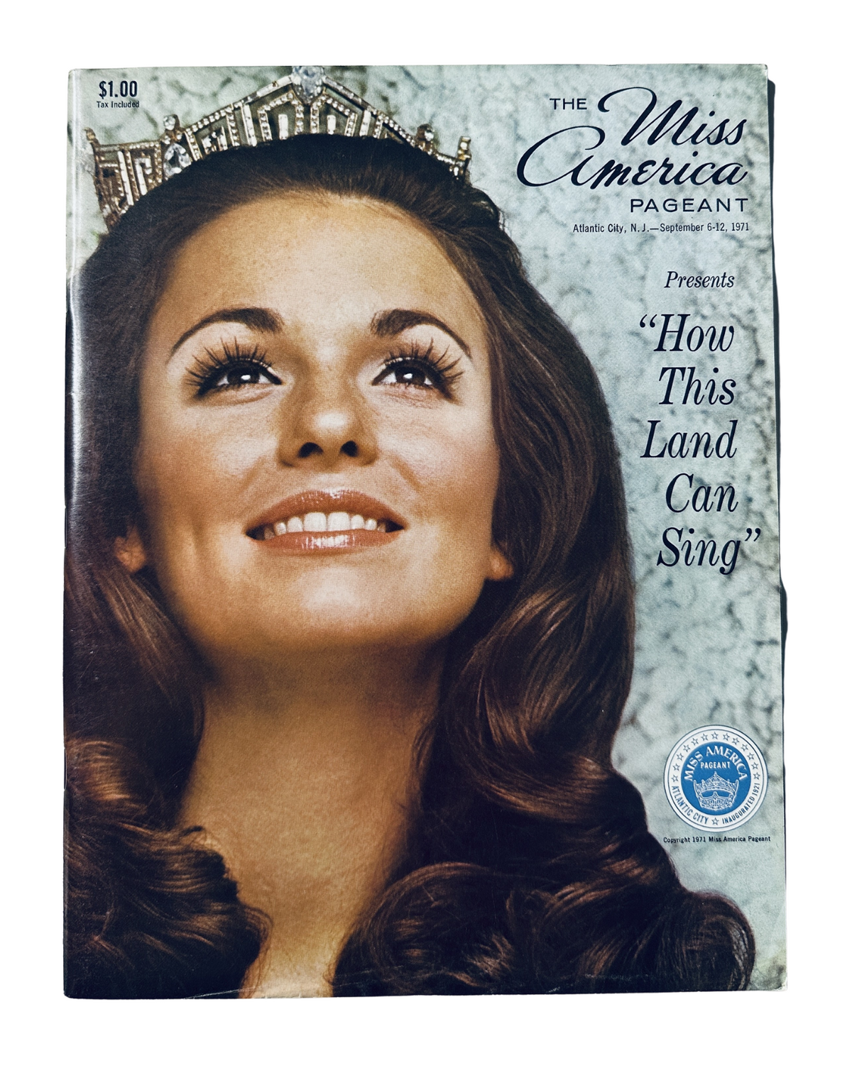 Cover of the Miss America Pageant Magazine, September 6, 1971, featuring Phyllis George with the headline 'How This Land Can Sing.' The magazine highlights the iconic event with a beautiful portrait of Phyllis George, showcasing her crown and elegant hairstyle.