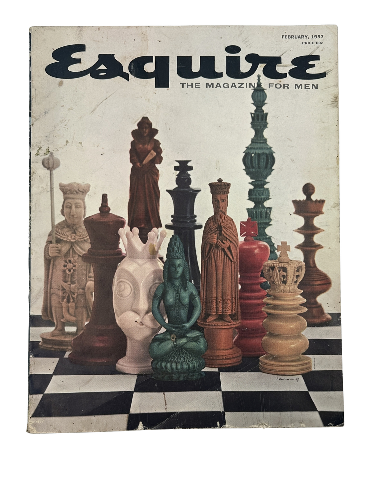 Esquire Magazine February 1957 cover featuring an artistic arrangement of chess pieces, showcasing unique designs and colors, emphasizing the magazine's focus on men's interests and culture.