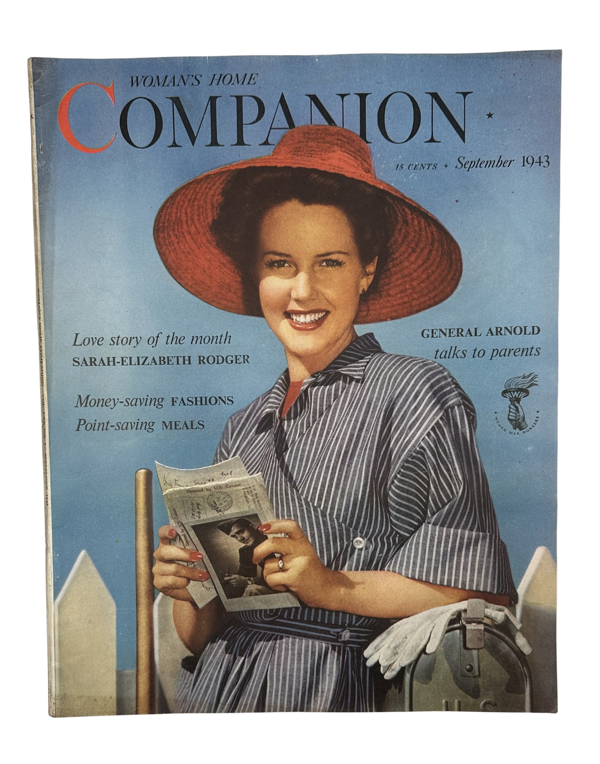 Cover of Woman’s Home Companion Magazine September 1943 featuring a smiling woman in a straw hat holding a newspaper, with the headline 'General Arnold talks to parents'.