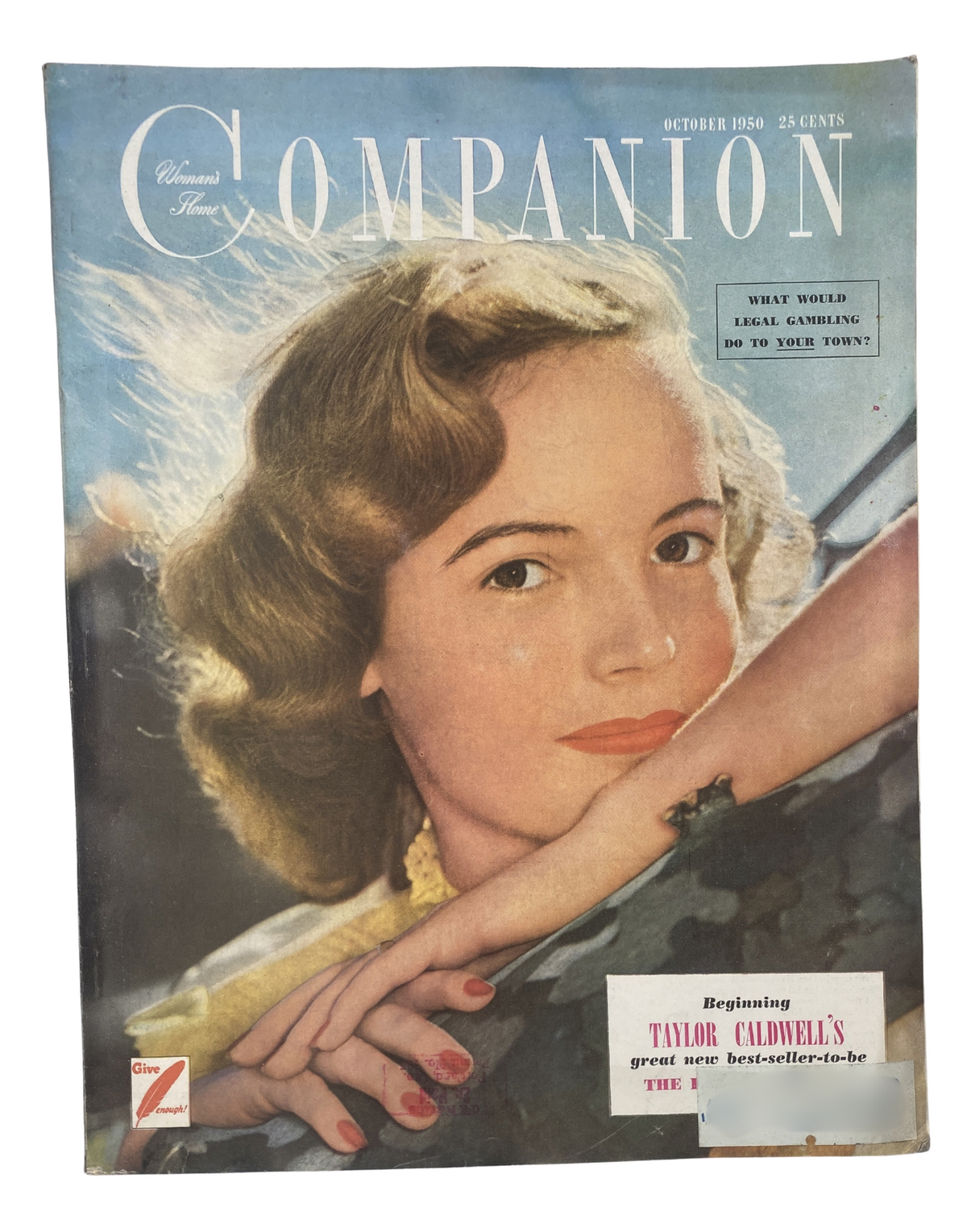 Woman’s Home Companion Magazine October 1950 cover featuring a model with wavy hair resting her chin on her hand. The magazine promotes Taylor Caldwell's upcoming bestseller and discusses the topic of gambling in towns.