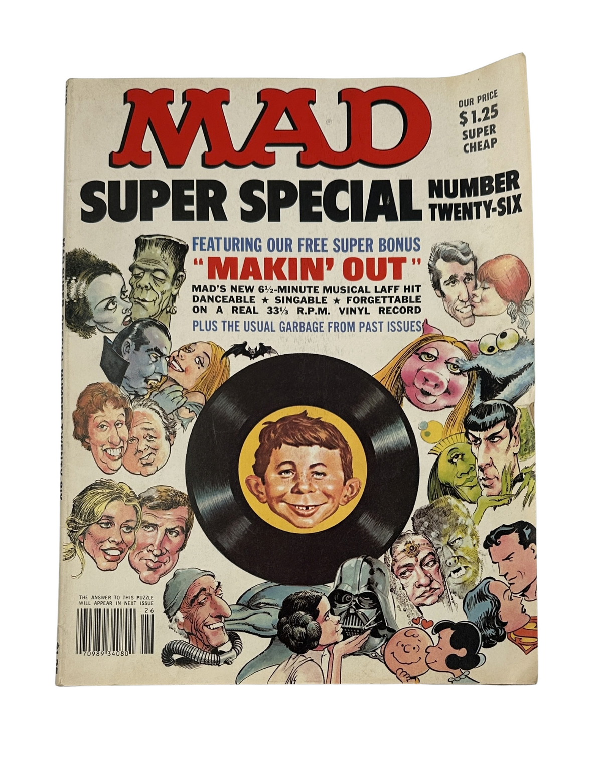 MAD Magazine Super Special No. 26 1974 cover featuring a humorous caricature with a vinyl record insert for the song 'Makin' Out'. The cover highlights a vintage art style, showcasing various characters and iconic illustrations.
