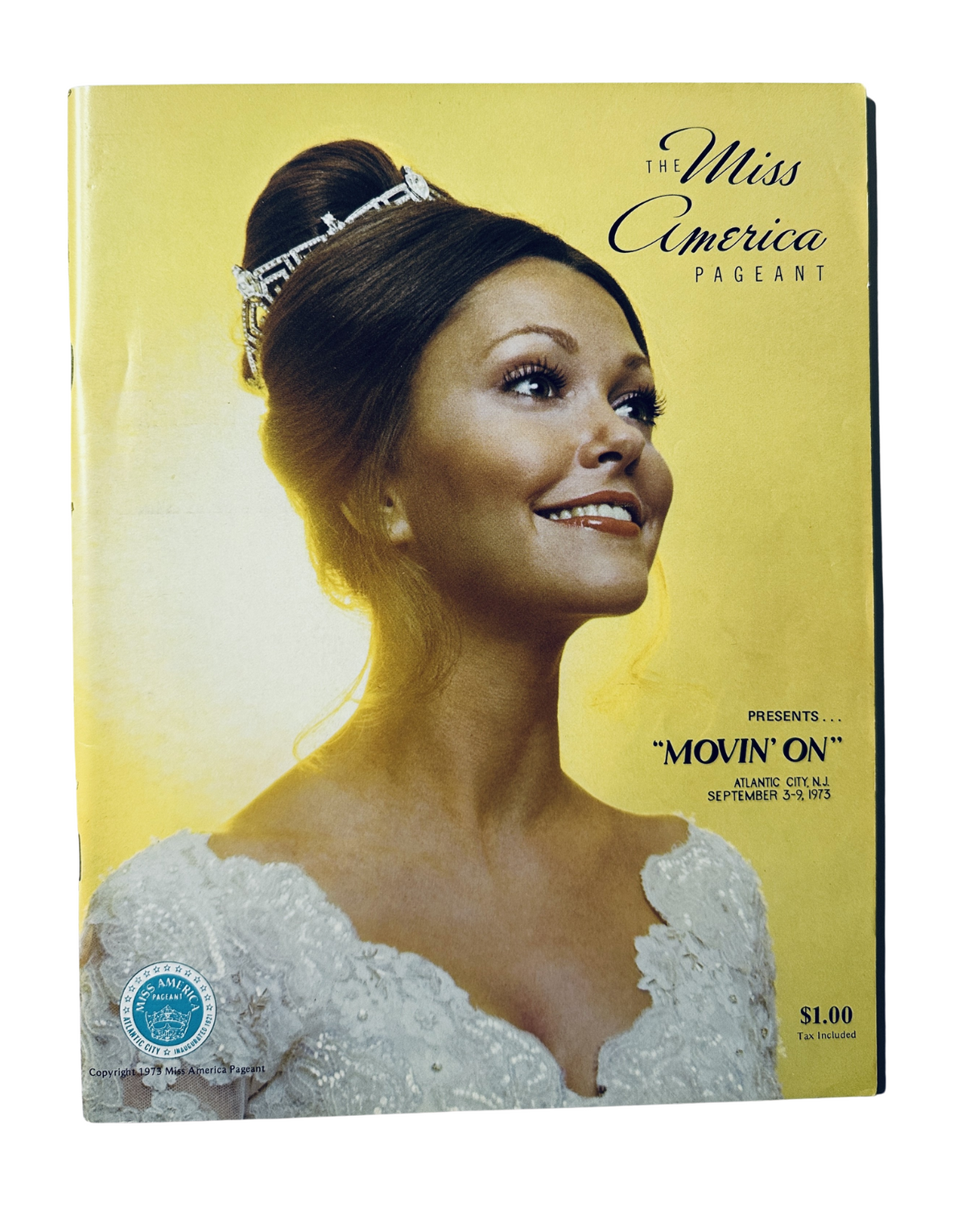Cover of the Miss America Pageant Magazine from September 3–9, 1973 featuring Terry Meeuwsen, smiling and dressed in a white gown with a tiara, promoting the theme 'MOVIN’ ON'.