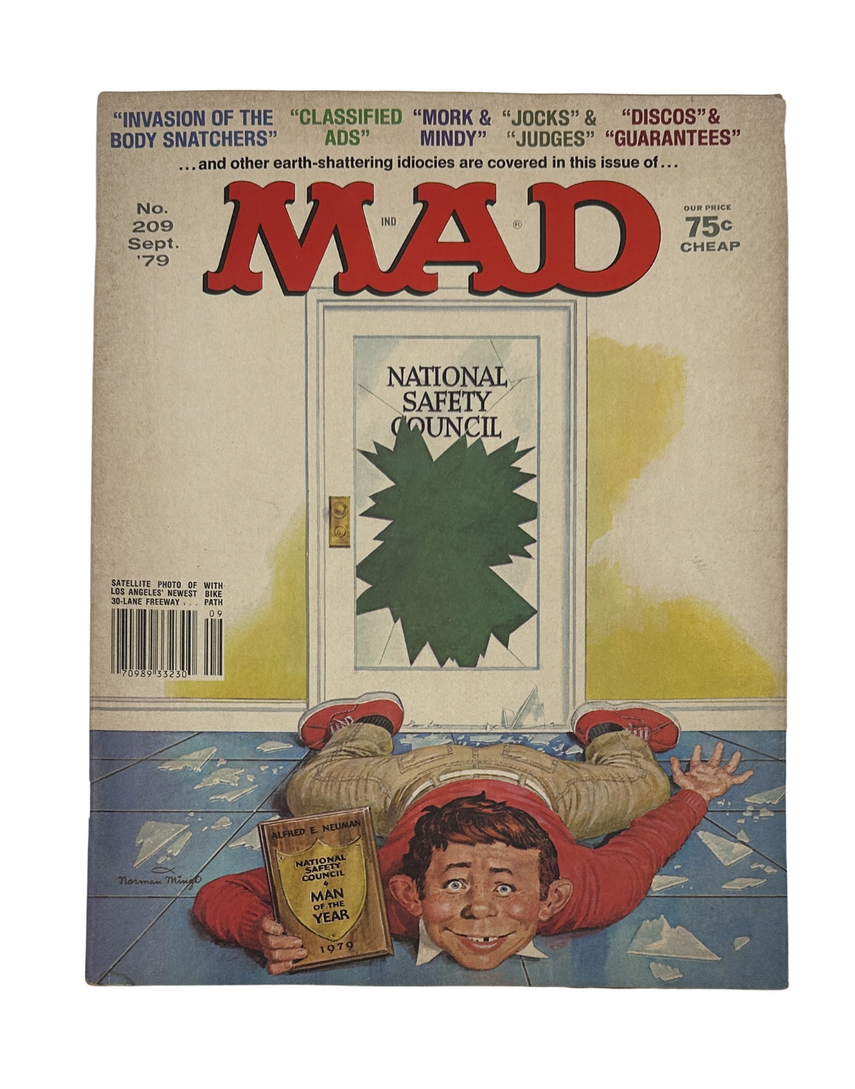 Cover of MAD Magazine No. 209 from September 1979 featuring the theme 'Invasion of the Body Snatchers' with a humorous illustration of a boy on the floor, emphasizing the magazine's satirical style.