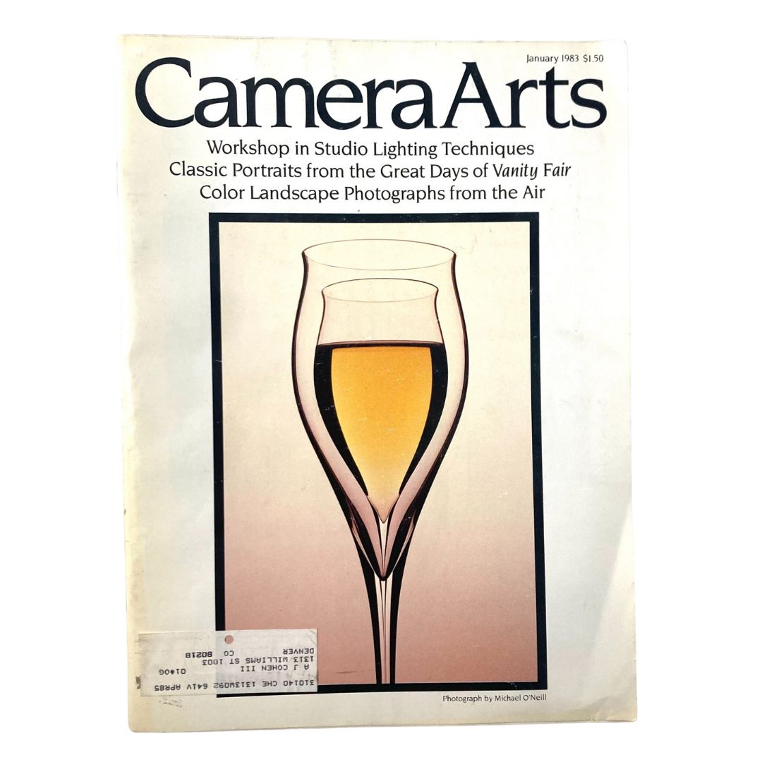 Cover of Camera Arts Magazine January 1983 featuring a stylized illustration of a glass and colors, highlighting Color Landscapes Photographs from the Air.