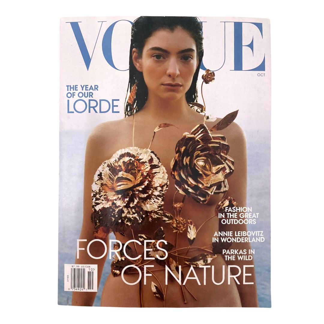 Vogue Magazine October 2021 cover featuring Lorde, titled 'The Year of Our Lorde' with floral decorations and a beach background.