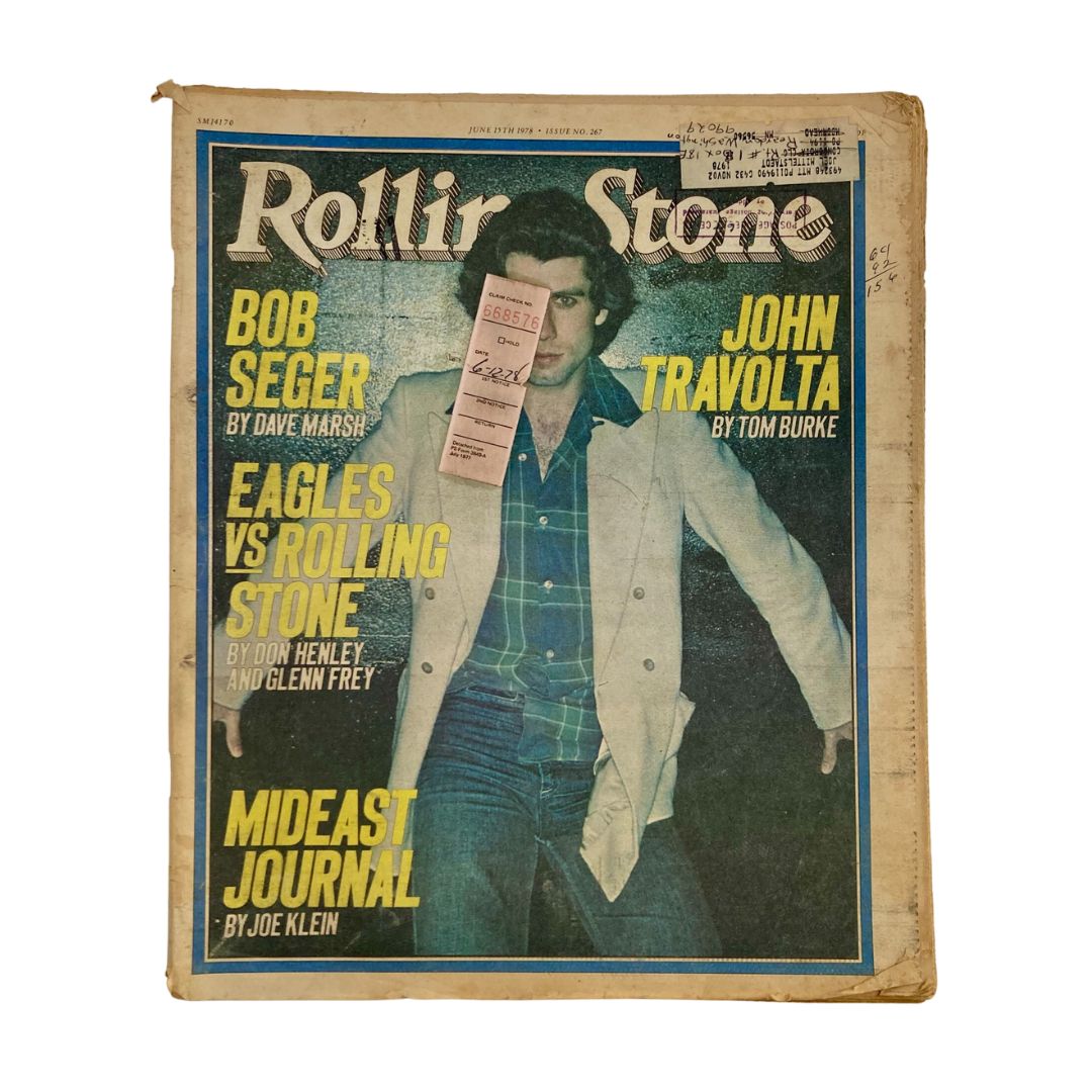 Rolling Stone Magazine June 15 1978 Cover featuring John Travolta by Tom Burke, showcasing the iconic star in a stylish outfit against a vibrant backdrop.