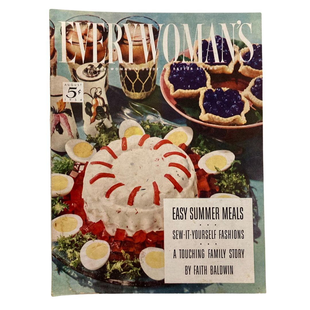 Cover of the VTG Every Woman's Magazine from August 1954 featuring a vibrant summer meal presentation including a salad mold, hard-boiled eggs, and blue and berry desserts, showcasing easy summer meals and family stories.