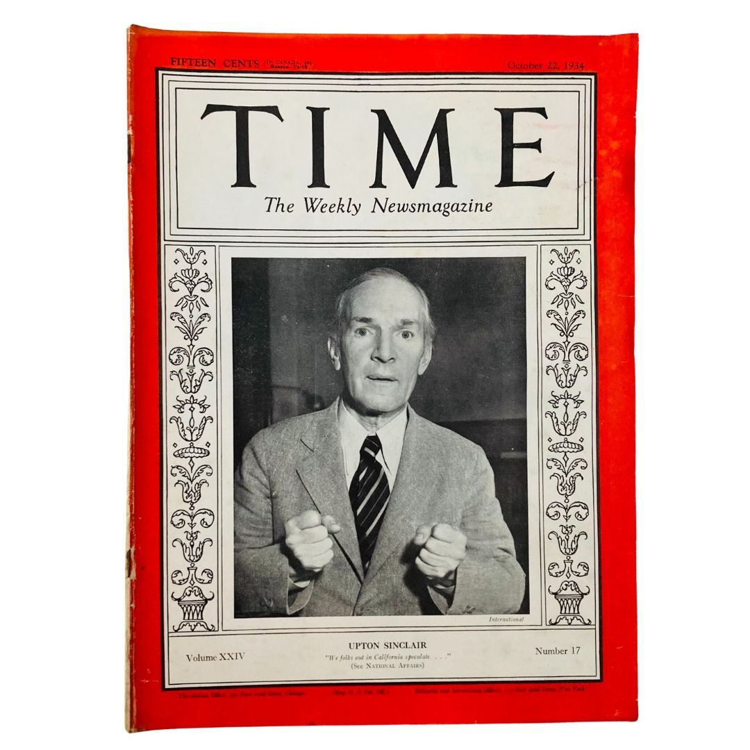 Cover of VTG Time Magazine from October 22, 1934, featuring American writer Upton Sinclair, showcasing a portrait of Sinclair with his fists raised, representing his activism and literary significance.