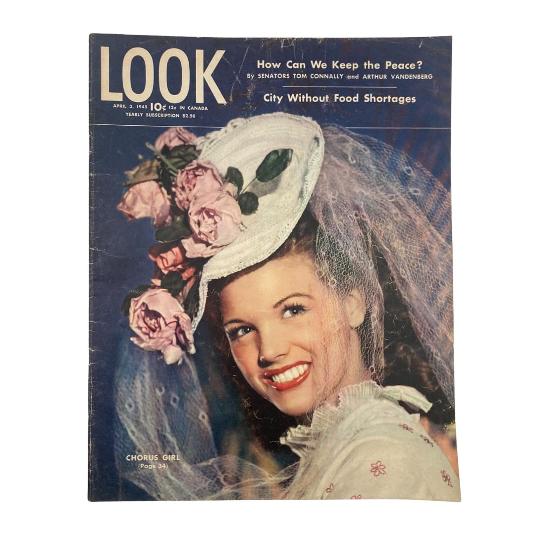 Cover of Look Magazine April 3 1945 featuring a chorus girl in a floral hat and veil, highlighting the theme of post-war entertainment titled 'City Without Food Shortages.'