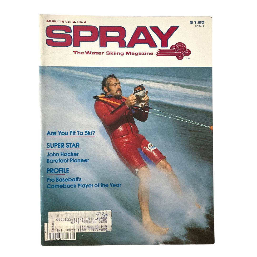Cover of Spray The Waterskiing Magazine April 1978 featuring John Hacker, a barefoot pioneer, holding a waterski while skiing on the water. The magazine includes headlines related to waterskiing and showcases the vibrant culture of the late 1970s.