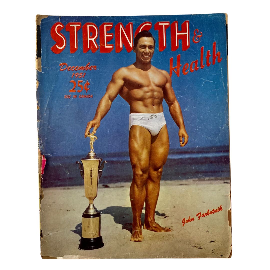 Cover of VTG Strength & Health Magazine December 1951, featuring a muscular man holding a trophy on the beach, designed by John Farbotnik.